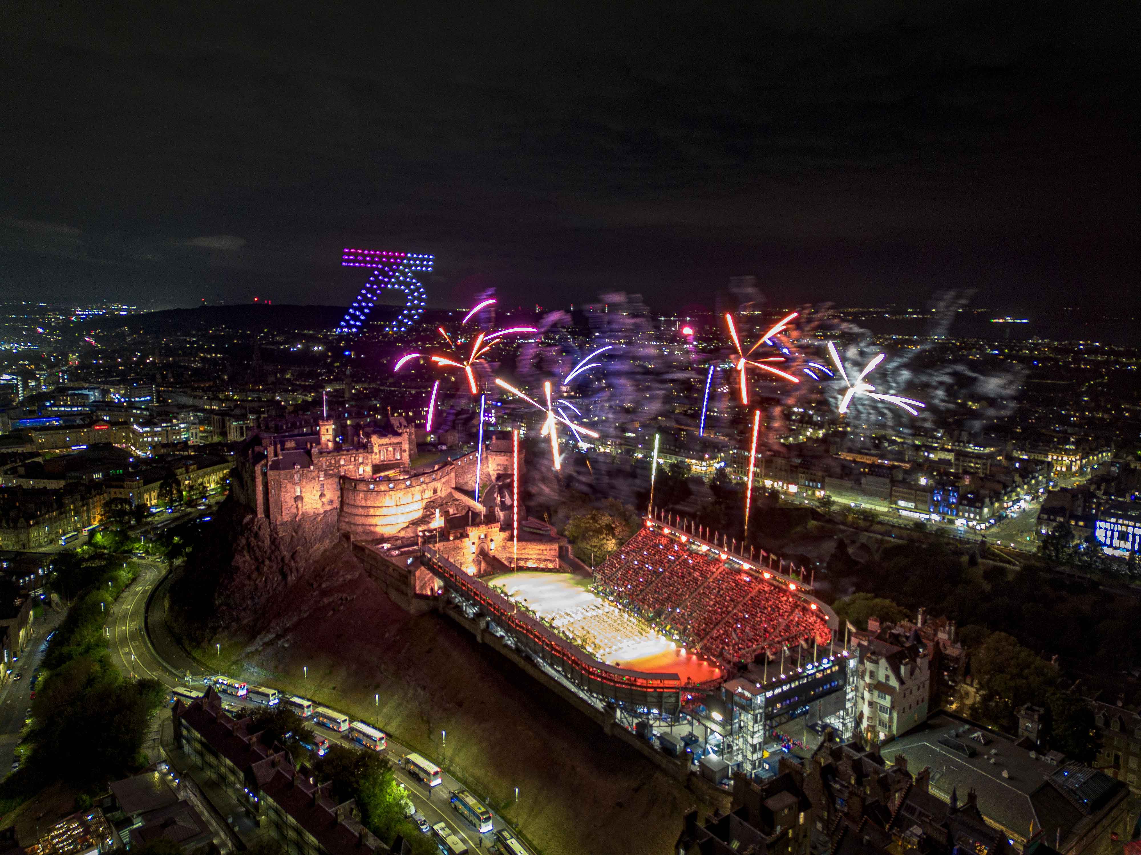 100 drones flying over Edinburgh Castle for The Royal Edinburgh Military Tattoo forming the number 75 for the event's anniversary